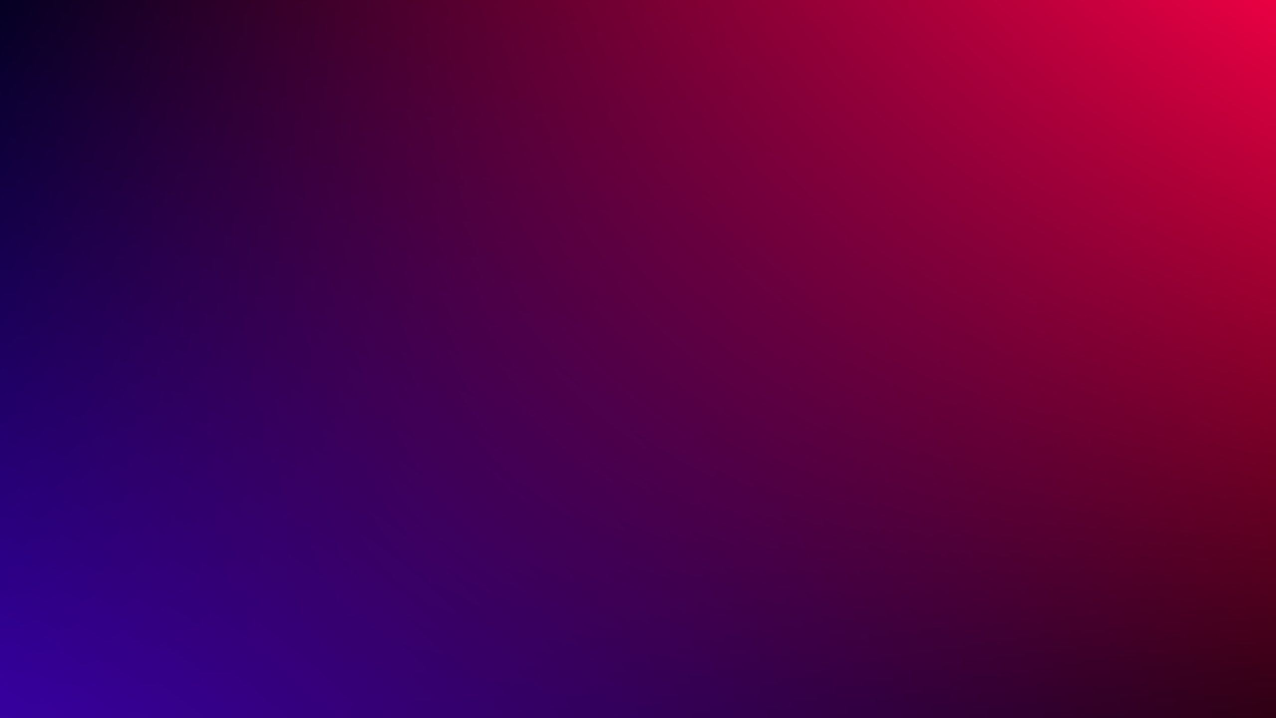 Abstract gradient background transitioning from deep blue and purple into warm red, smooth and moody